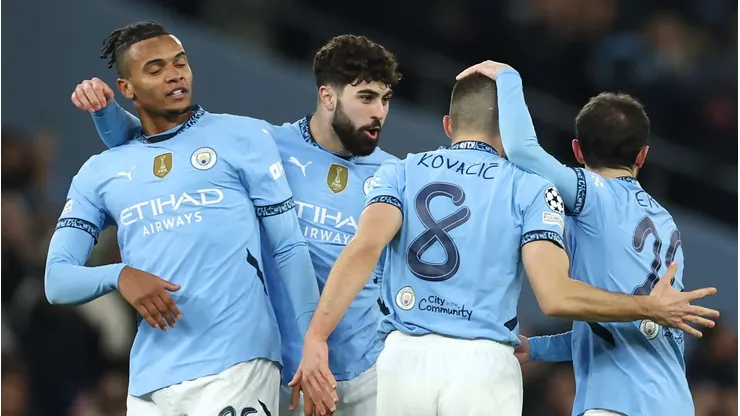 Manchester City players celebrate a team goal