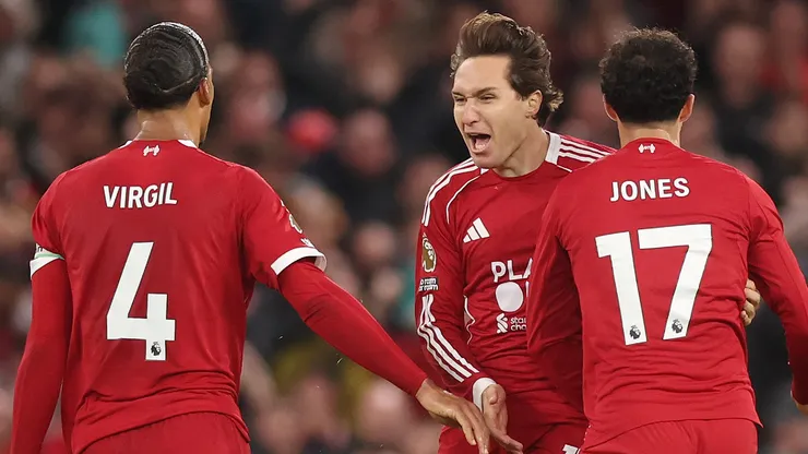 Liverpool players celebrate a team goal