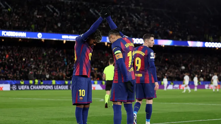 Lamine Yamal and Raphinha celebrating a goal for Barcelona.
