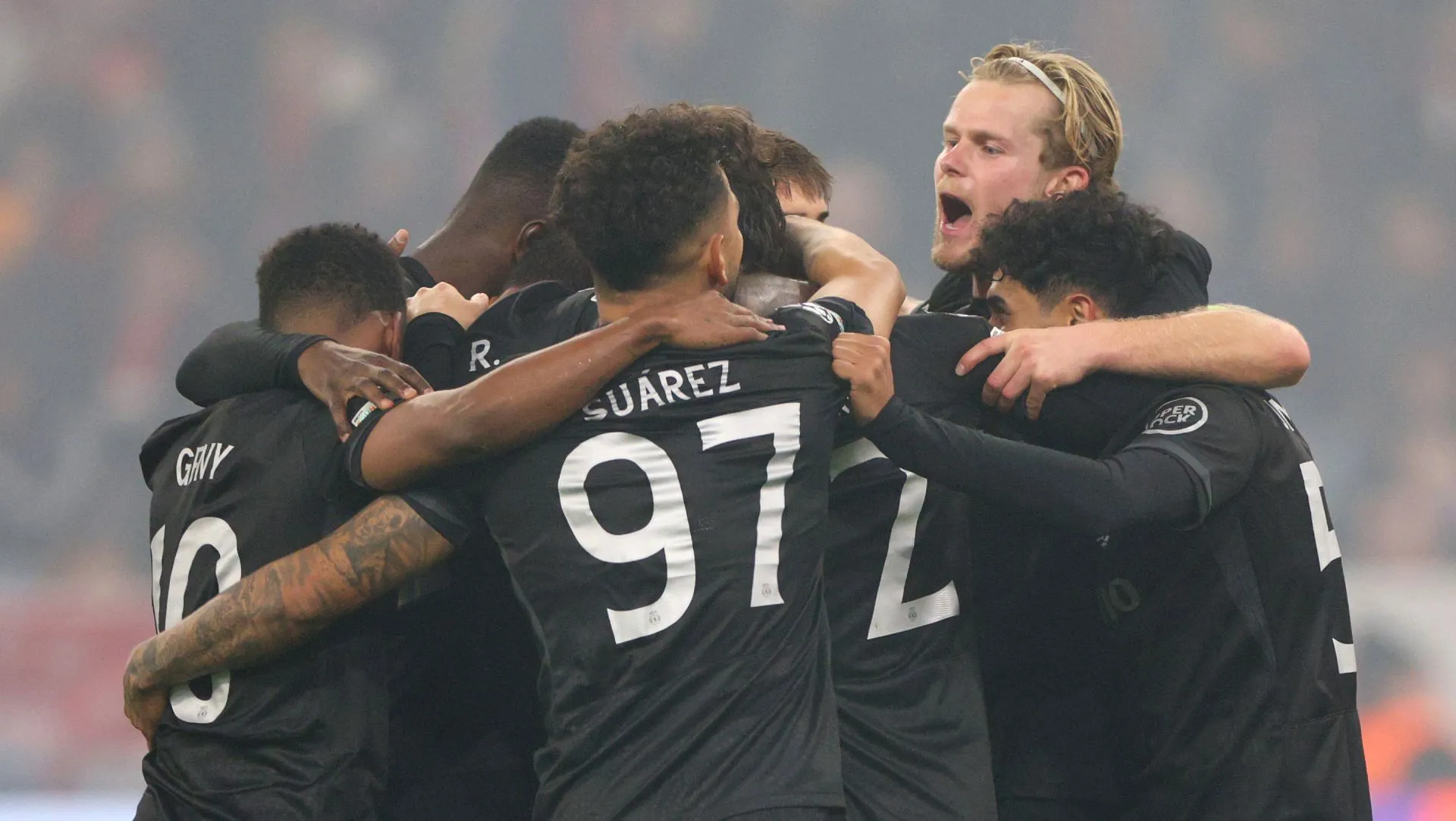 Sporting players celebrate a goal during a Champions League match