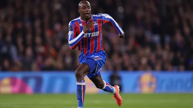 Jean-Philippe Mateta challenges for the ball during a Conference League match